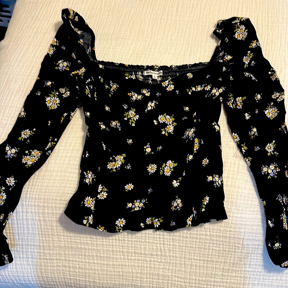 Reformation Daisy flower on black top
